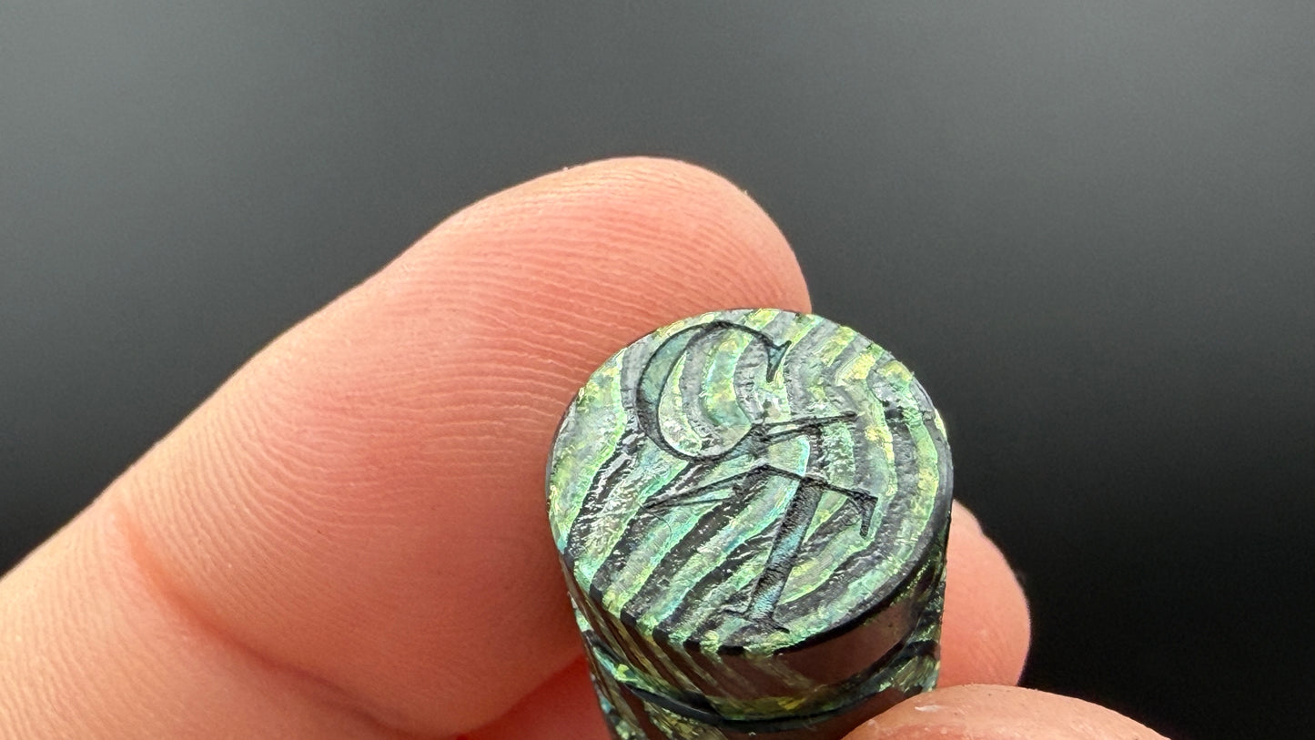 Green ZircuTi two line The End Bead
