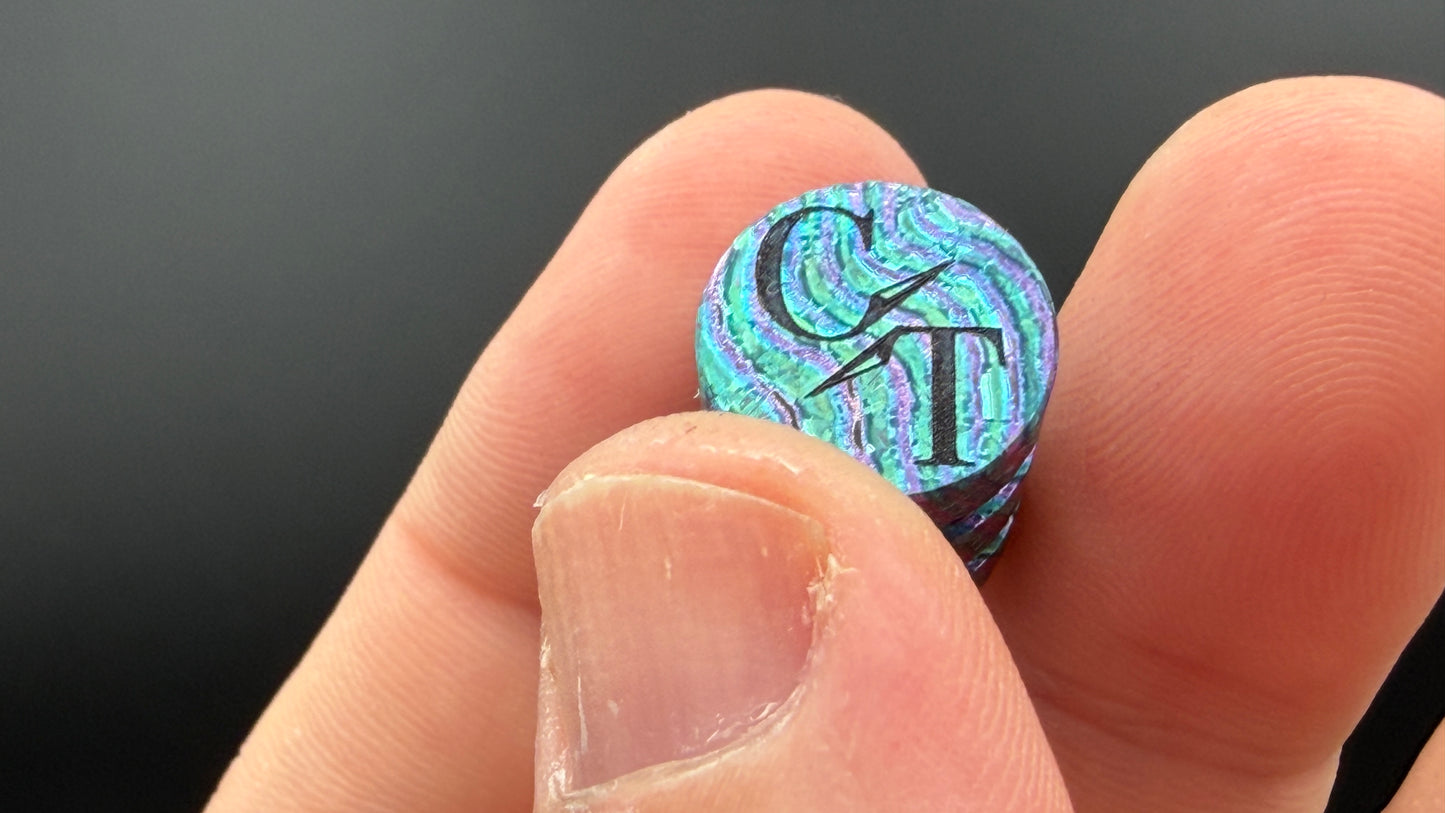 Purple, blue and green Zircuti two line The End Bead