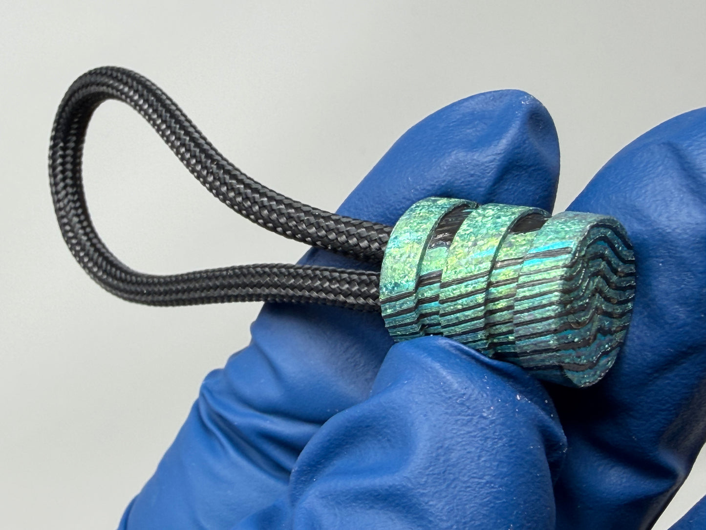 Green ZircuTi two line The End Bead