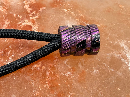 Purple, pink and gold Zircuti two line The End Bead