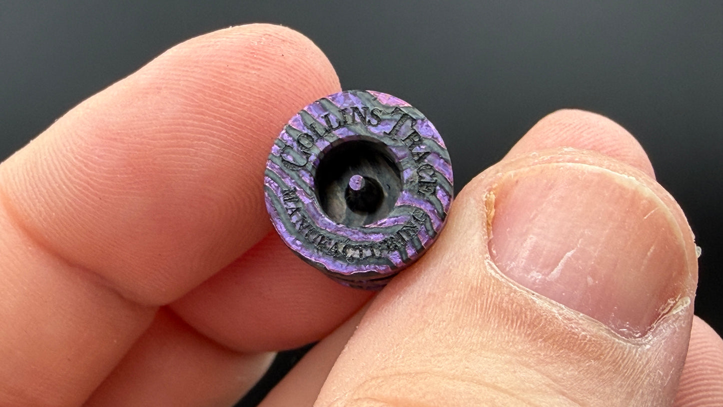 Purple, pink and gold Zircuti two line The End Bead